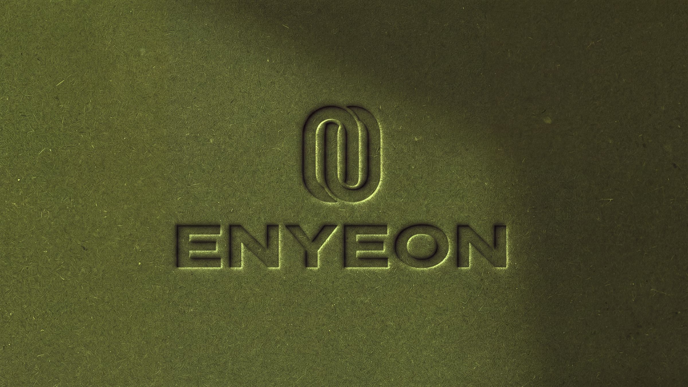 The EnYeon logo debossed into green paper
